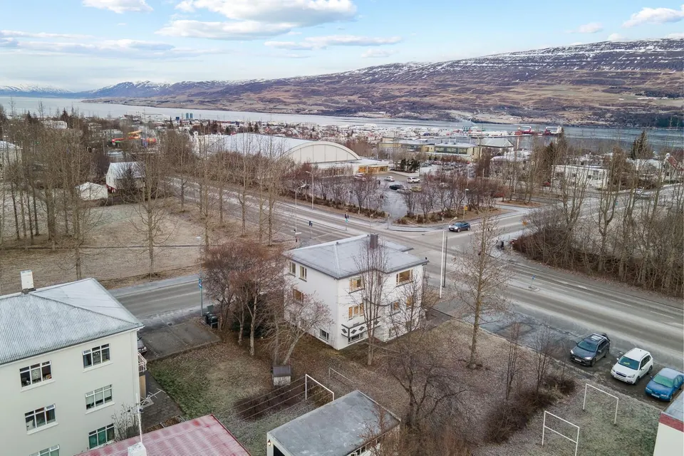 Aerial view of Acco Guesthouse with Akureyri, the fjord and the mountains behind